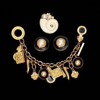 699. A bracelet, brooch and a pair of earrings by St John.