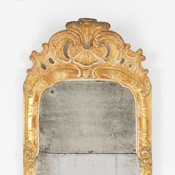 A Swedish rococo giltwood mirror, later part of the 18th century.