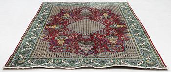 A Ghom carpet, approx. 259 x 154 cm.