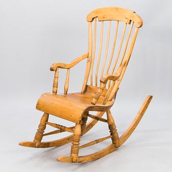 A Wooden Rocking Chair.