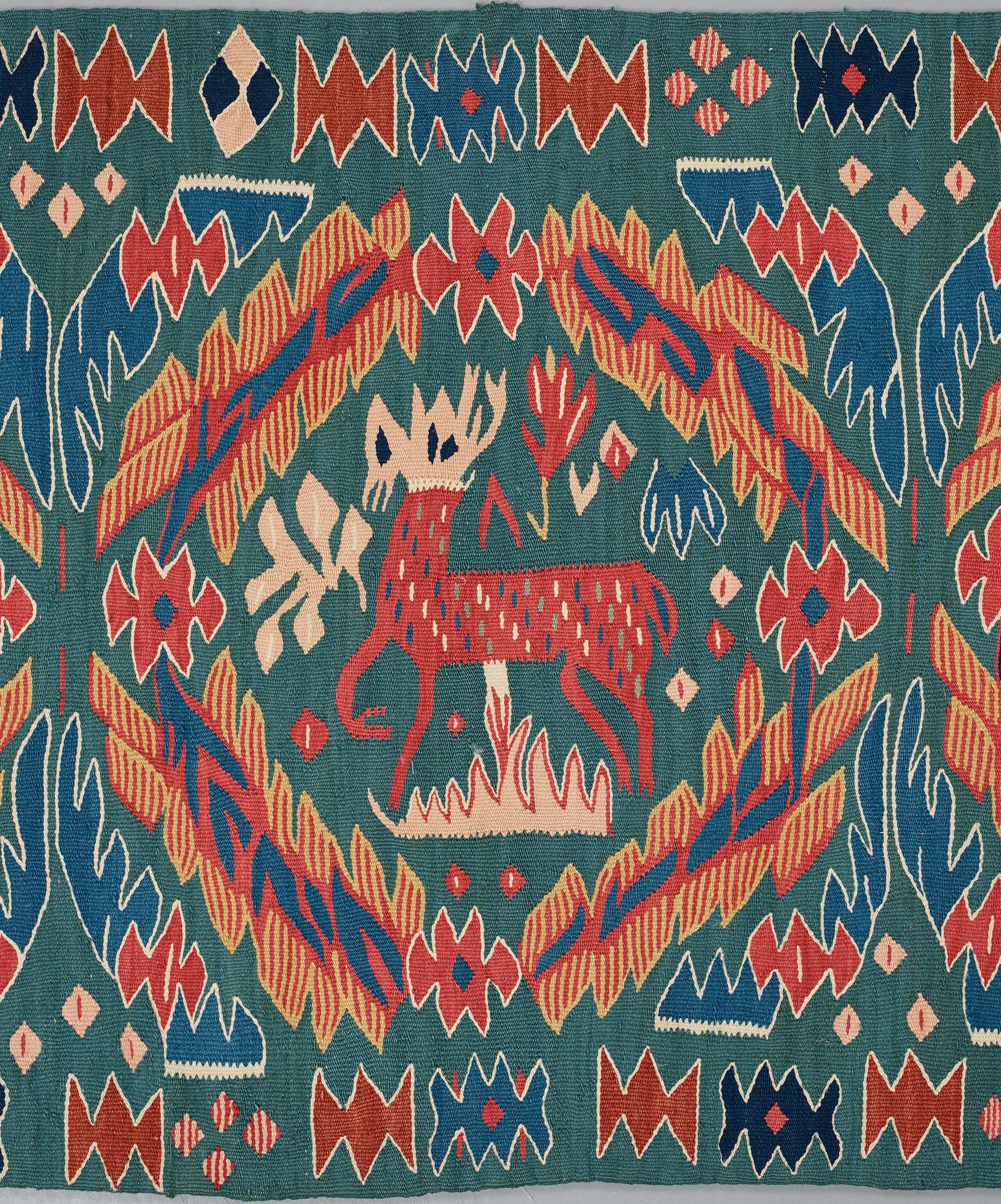 A CARRIAGE CUSHION, tapestry weave, "Kungahjorten", ca 50 x 104,5 cm, Scania (Sweden),