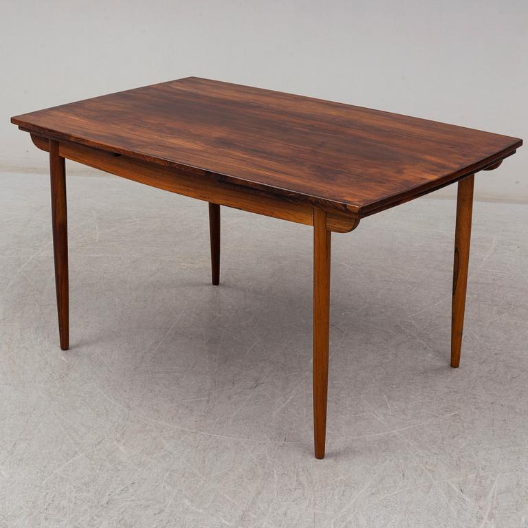 A 1950's/60's rosewood dinner table with four chairs, Denmark.