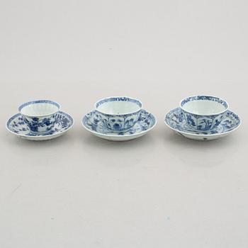 Three (a pair + one) blue and white cups with saucers, China, Kangxi (1662-1722).