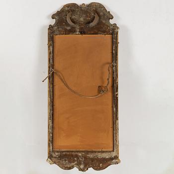 A rococo mirror, mid 18th century.