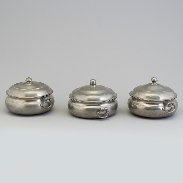 A set of three tin PORRIDGE BOWLS, 19th century.