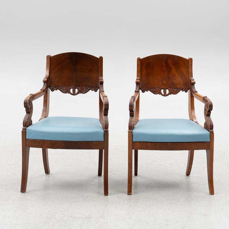 A pair of Baltic late Empire mahogany open armchairs, ca 1840.