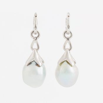 A pair of 18K white gold earrings set with cultured South Sea pearls and round brilliant-cut diamonds.