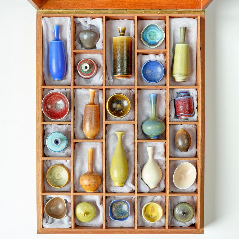 Berndt Friberg, a teak casket with 24 stoneware miniatures, Gustavsberg Studio, Sweden.