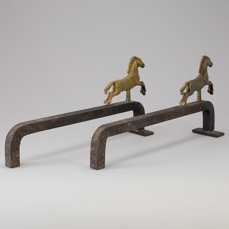 A PAIR OF IRON AND BRASS ANDIRONS by Tore Kullander, Borås 1943.
