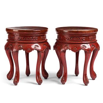 A pair of Chinese red lacquered stools/stands, early 20th century.