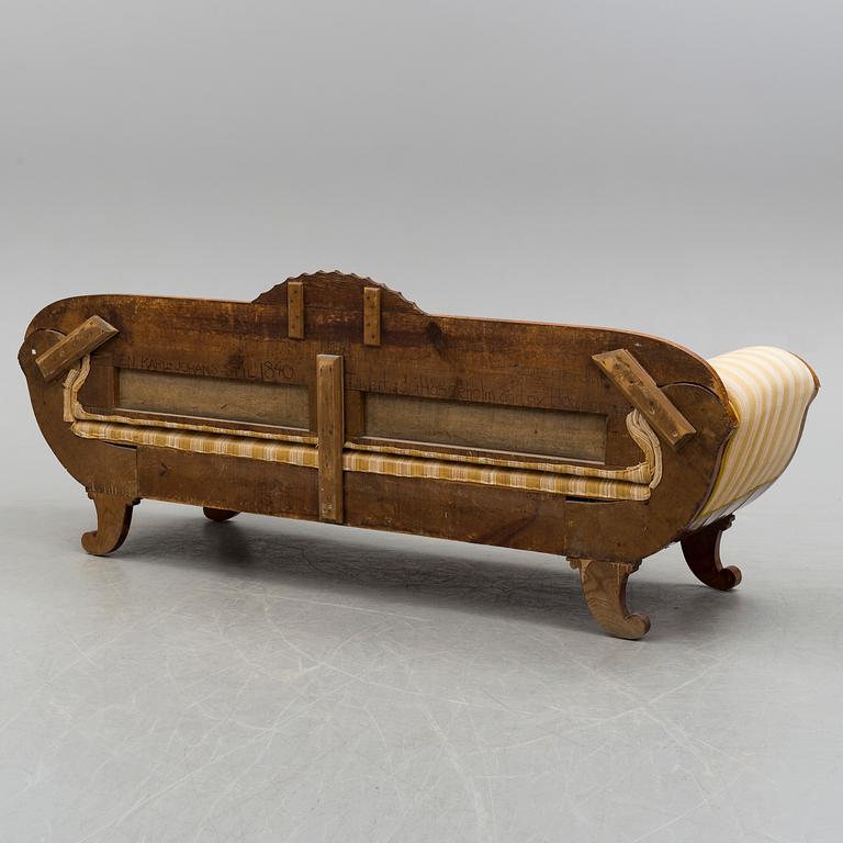 A mahogany sofa dated 1840.