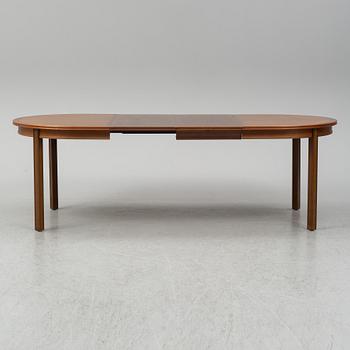 A late 20th century dining table. Two leaves included.