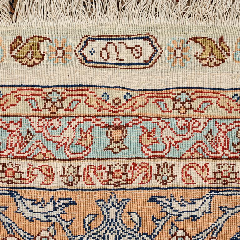 A carpet, an old silk Turkey, ca 237,5 x 146,5  cm (as well as 3,5-4 cm flat weave at the ends).