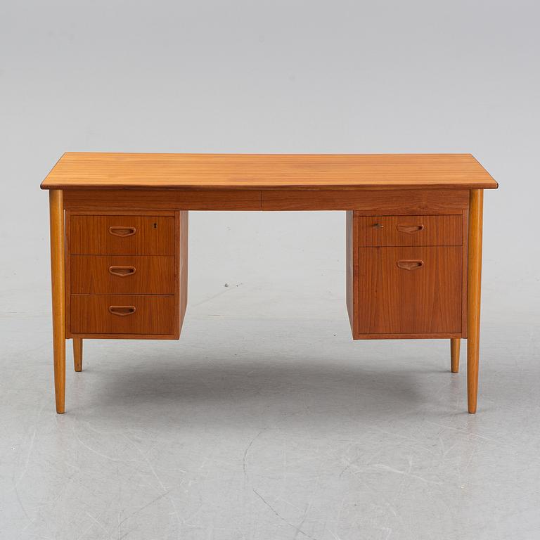 A 1950/60's oak and teak writing desk.