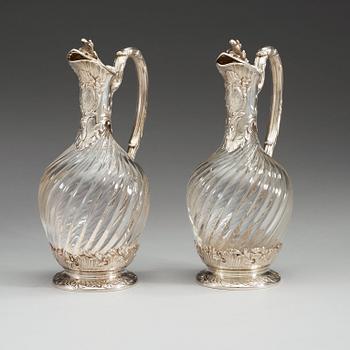 A pair of French late 19th century silver and glass wine-flagons.