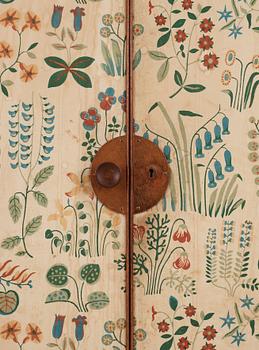 A Josef Frank mahogany cabinet, doors and sides covered in Frank's floral chintz fabric 'Fatima', Svenskt Tenn ca 1937.