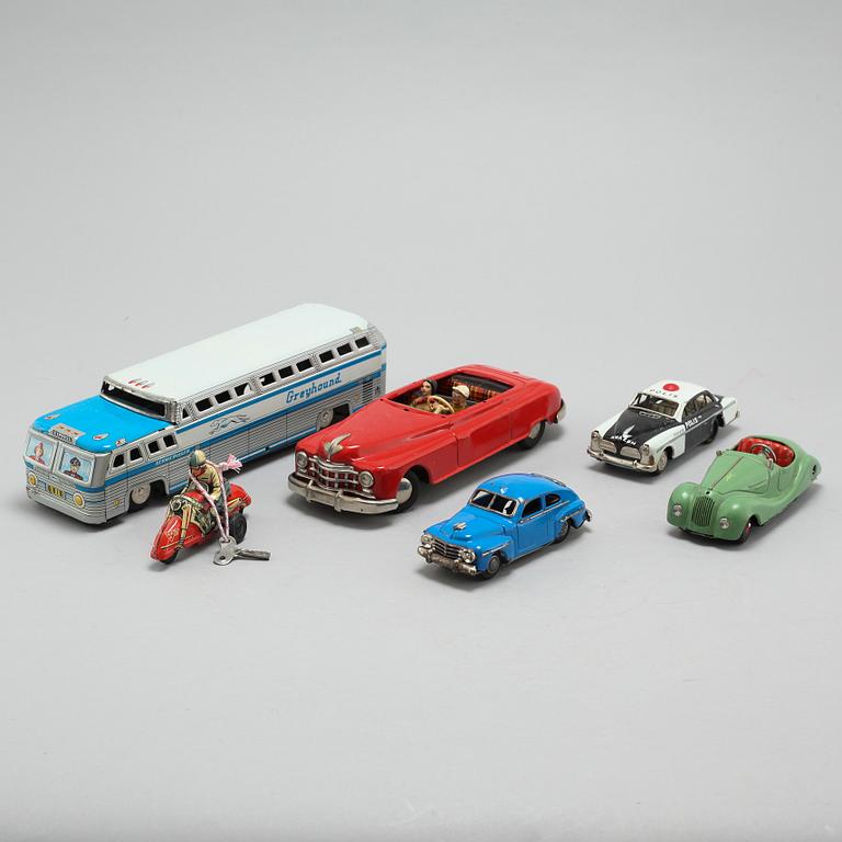 A collection of 6 tin toys, Schuco Akustico 2002, among others, circa mid 20th century.