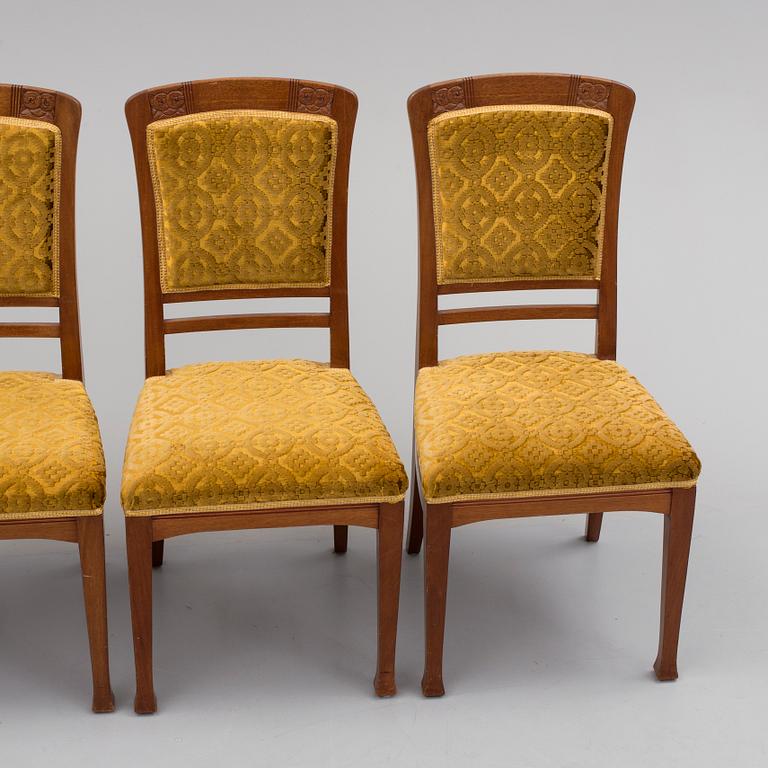 An early 20th century table with 4 chairs.