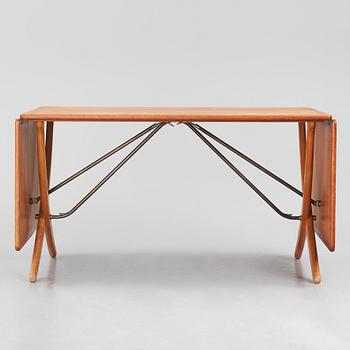 Hans J. Wegner, a teak, beech and brass dining table model 'AT-314' for Andreas Tuck, Denmark 1950-60s.
