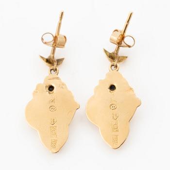 A pair of 18K gold earrings.