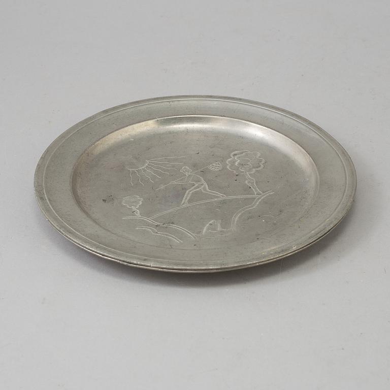 Two pewter Firma Svenskt Tenn plates from 1929.