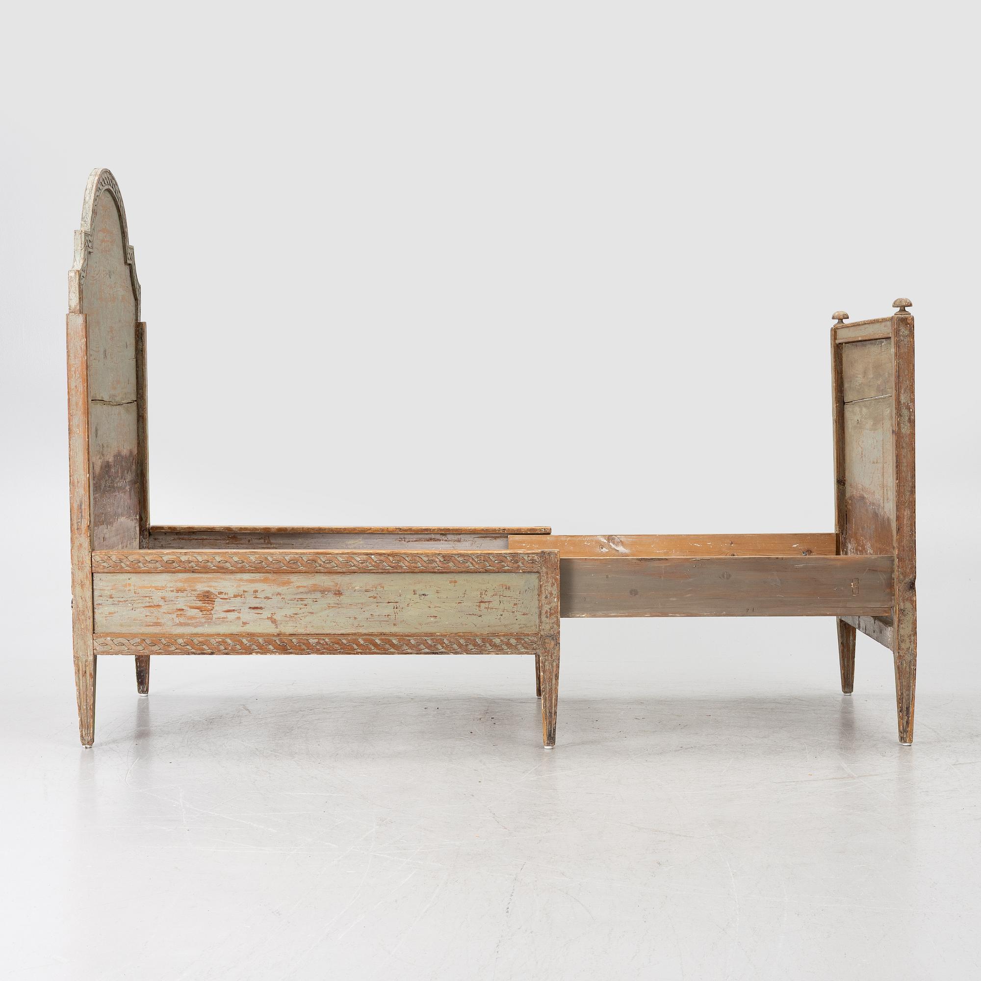 A Gustavian carved bedframe, late 18th century.