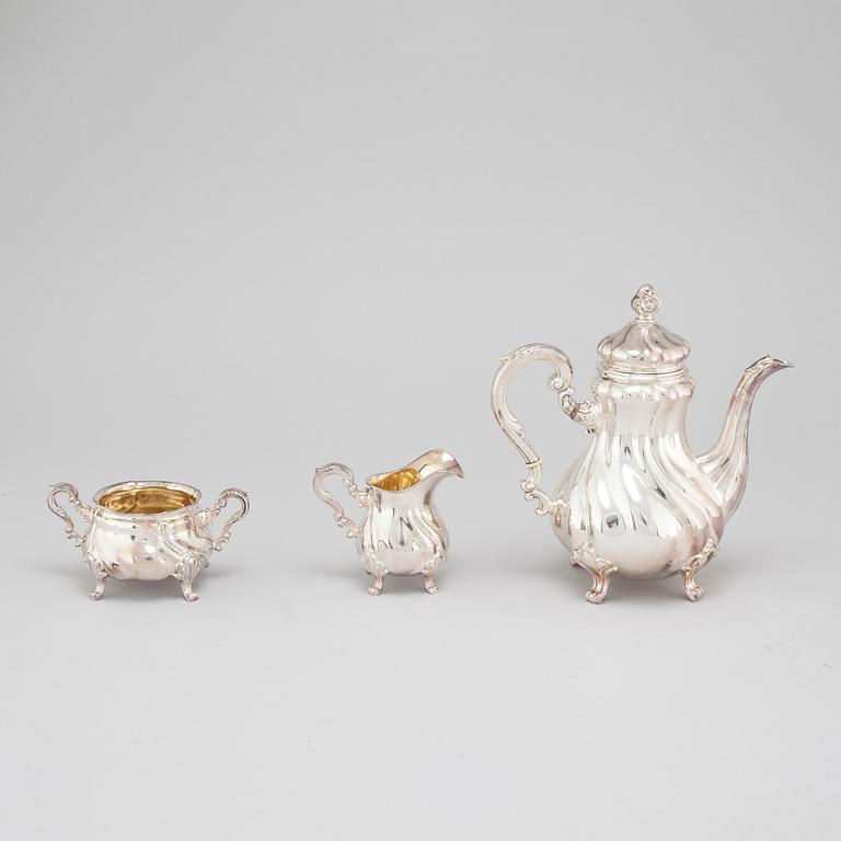 A silver coffee pot, creamer and sugar bowl with swedish import marks, 1930s.