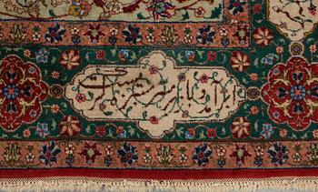 A carpet, semi-antique Tabriz, signed ca 335,5 x 256,5 - 261,5 cm.