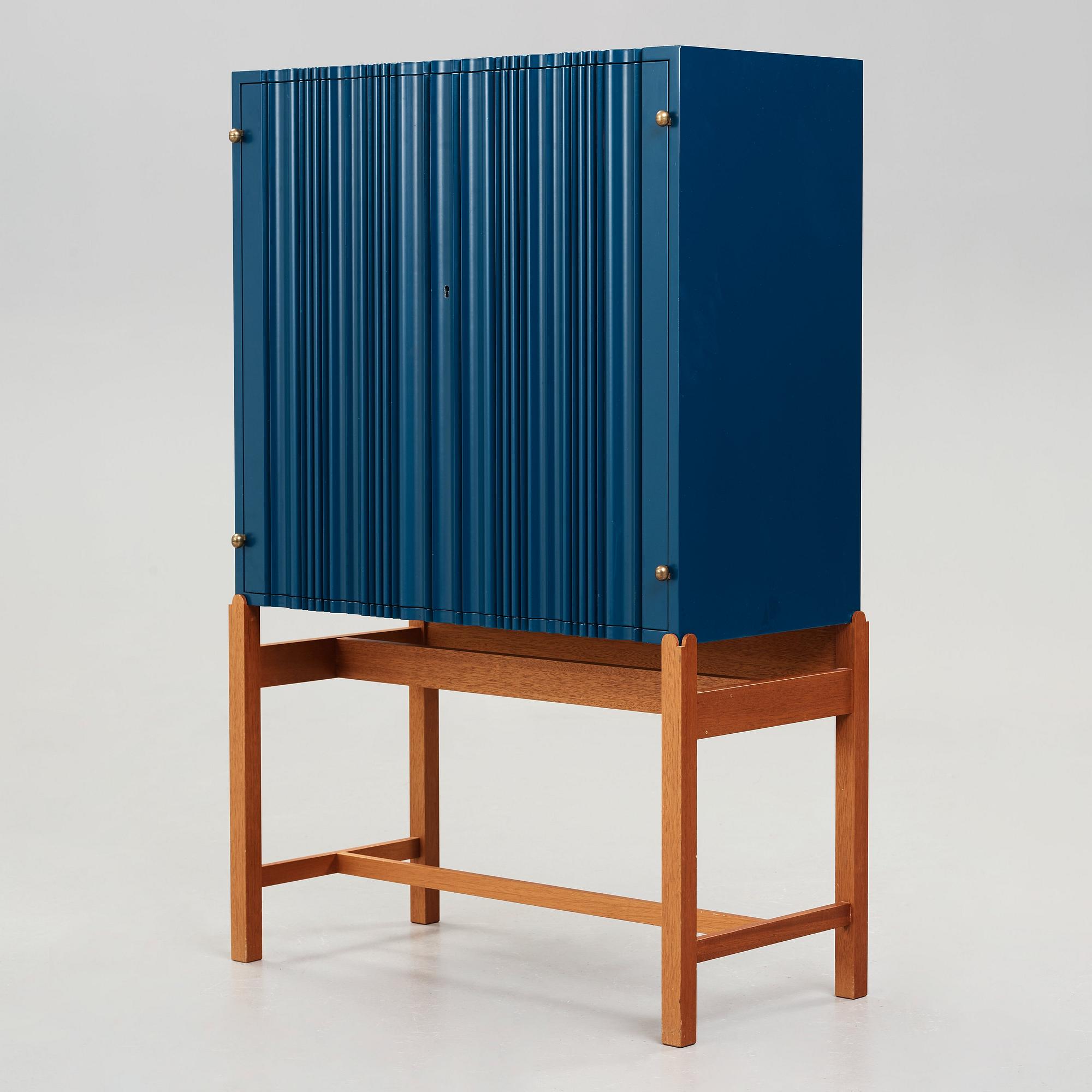 Josef Frank, a blue lacquered cabinet on stand, model nr 2192, by Svenskt Tenn, Sweden.