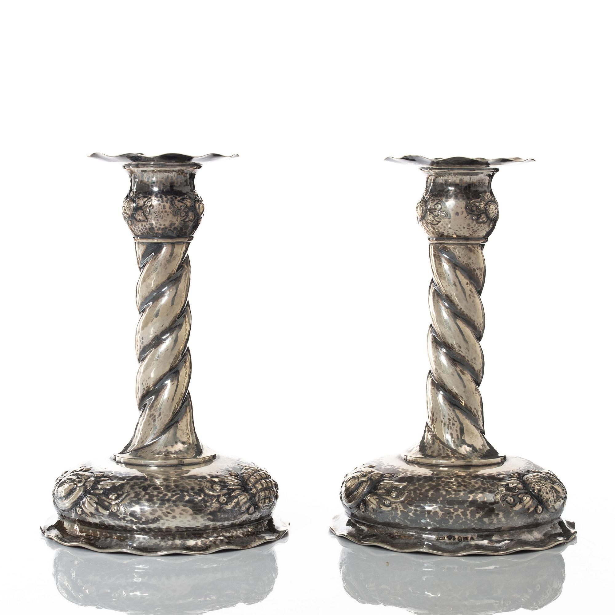 A pair of Baroque style silver candlesticks, marks of CG Hallberg, Stockholm 1942.