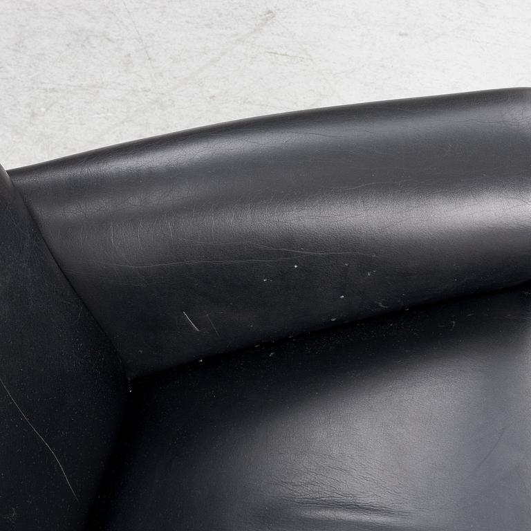 Hans J. Wegner, fåtölj med fotpall, "Ox Chair", EJ-100, Erik Jørgensen Møbelfabrik A/S, Svendborg, Danmark.