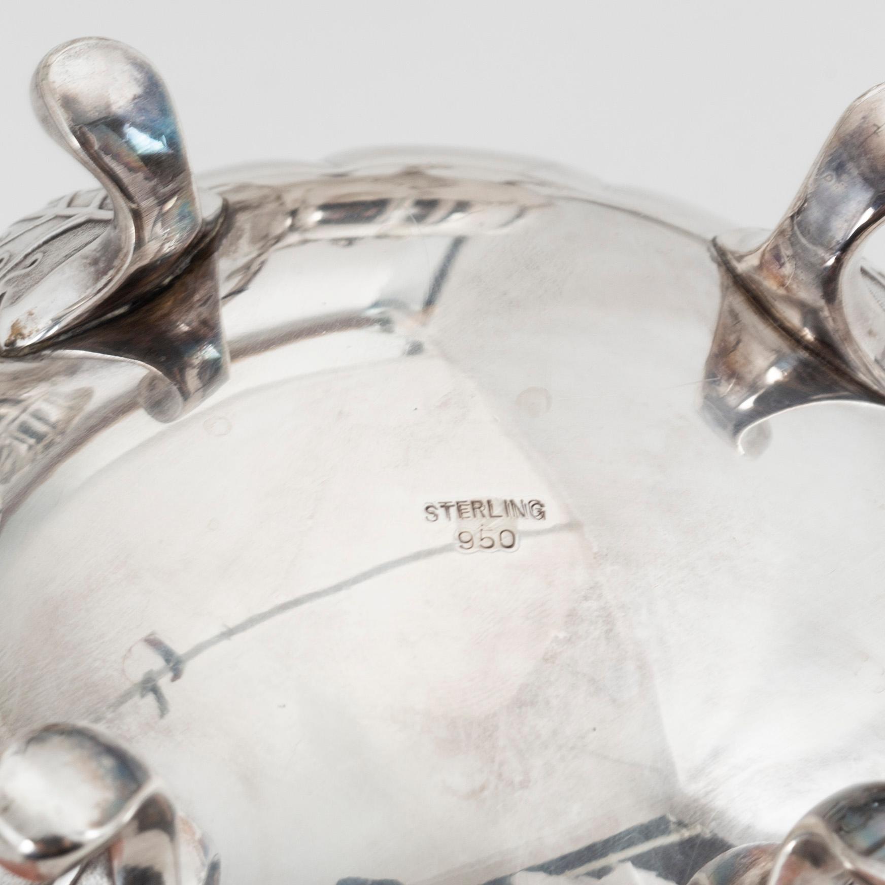 A rococo style sterling silver teapot, coffee pot, creamer and sugar bowl.