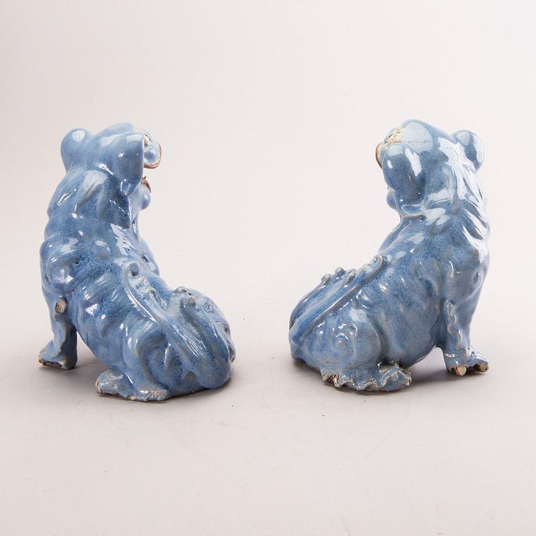 A pair of Chinese 19th century glazed Fo-dogs.