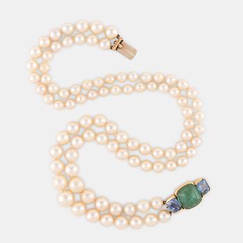 A two strand pearl necklace with a clasp signed D Webb.