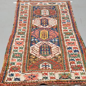 A RUNNER, a semi-antique Kazak, ca 273-277 x 100-105 cm (as well as ca 2,5 cm flat weave at one end).