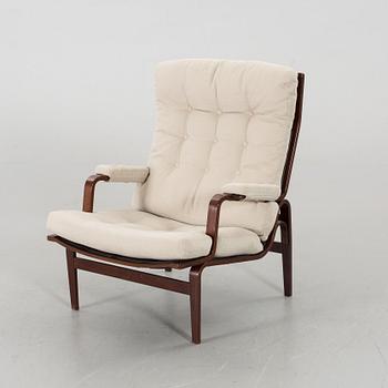 AN ARM CHAIR, By Bruno Mathsson Dux, late 20th century,