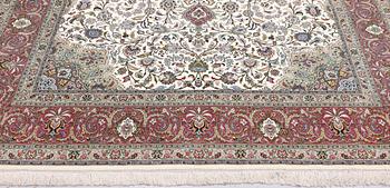 A part silk Tabriz carpet, 310 x 205 cm.