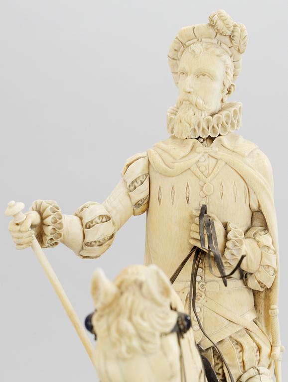 A late 19th century equestrian ivory, wood and metal statue.