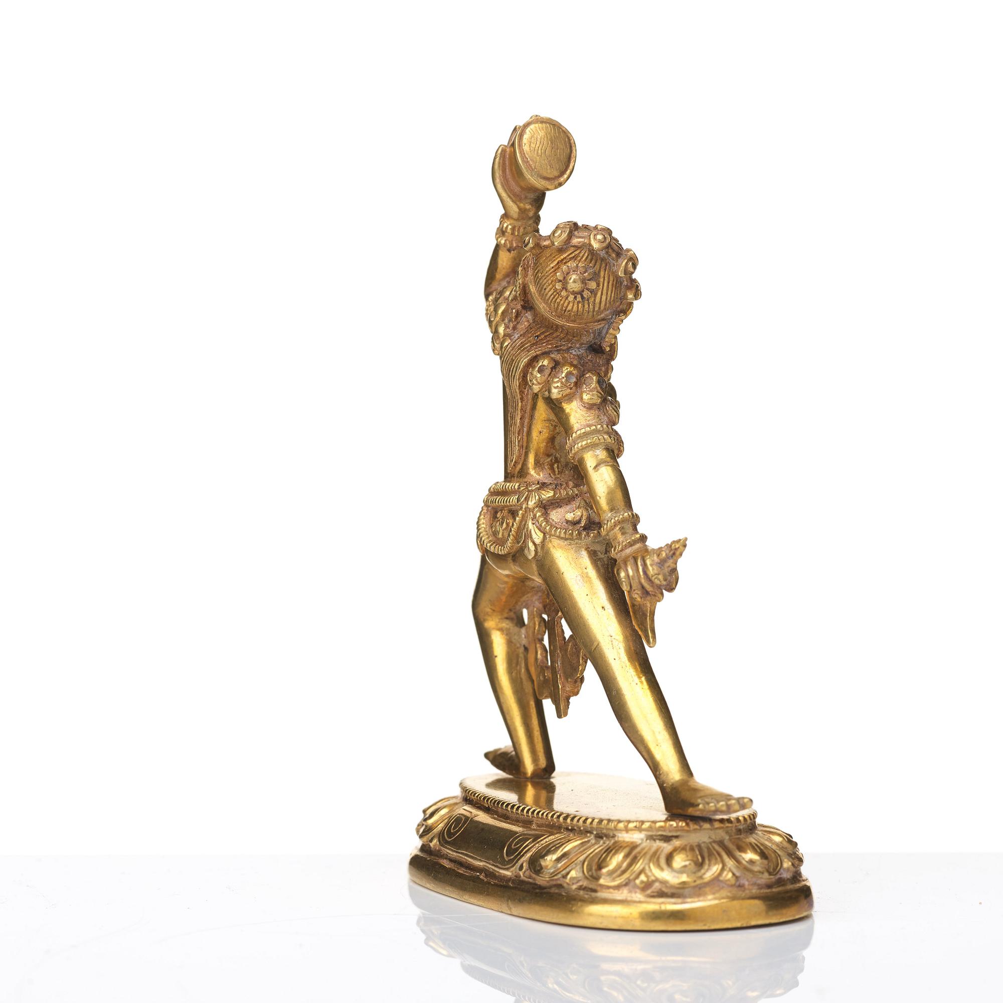 A gilt bronze figure of Dakini, Tibeto-Chinese, 19th Century.