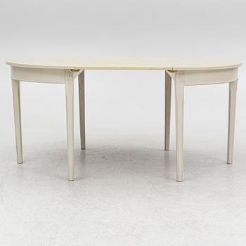 A Gustaivan style dining table/ two crescent shaped tables, end of the 19th century.