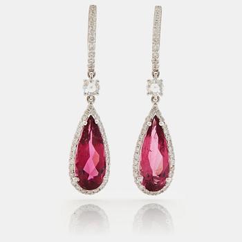 A pair of rubelite and brilliant cut diamond earrings.