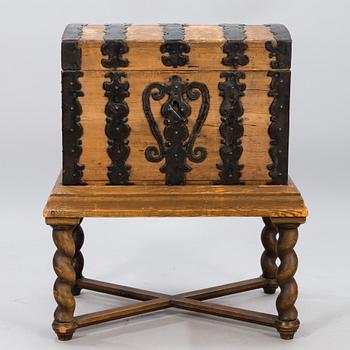 A oak baroque chest on a later leg frame.