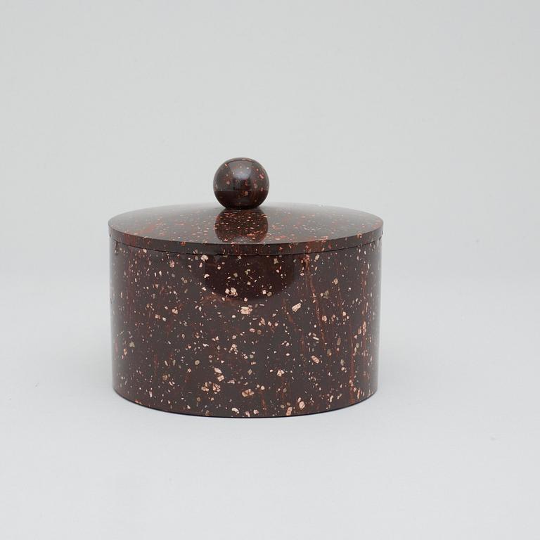 A Swedish Empire 19th century porphyry tobacco jar with cover.