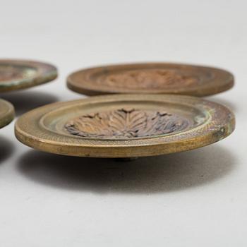 A SET OF FOUR BRONZE EMPIRE CURTAIN TIE-BACKS, first half of the 19th century.