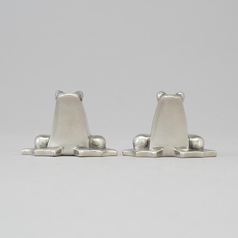 a pair of tin sculptures by Gunnar Cyrén.