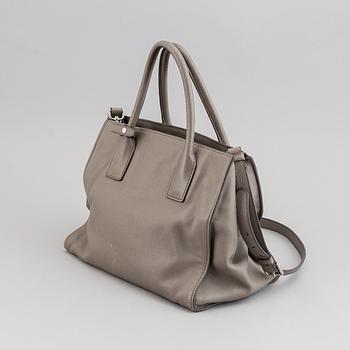 Prada, a leather handbag.