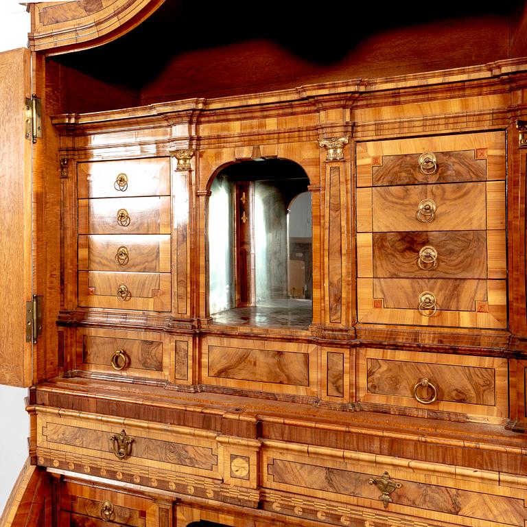 A German walnut and mahogany writing cabinet around 1800.