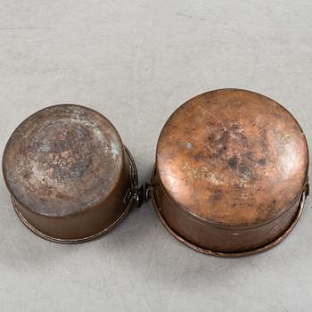 two copper pots from the 19th century.