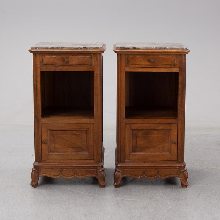 A pair of walnut marble top bedside tables, first half of the 20th Century.