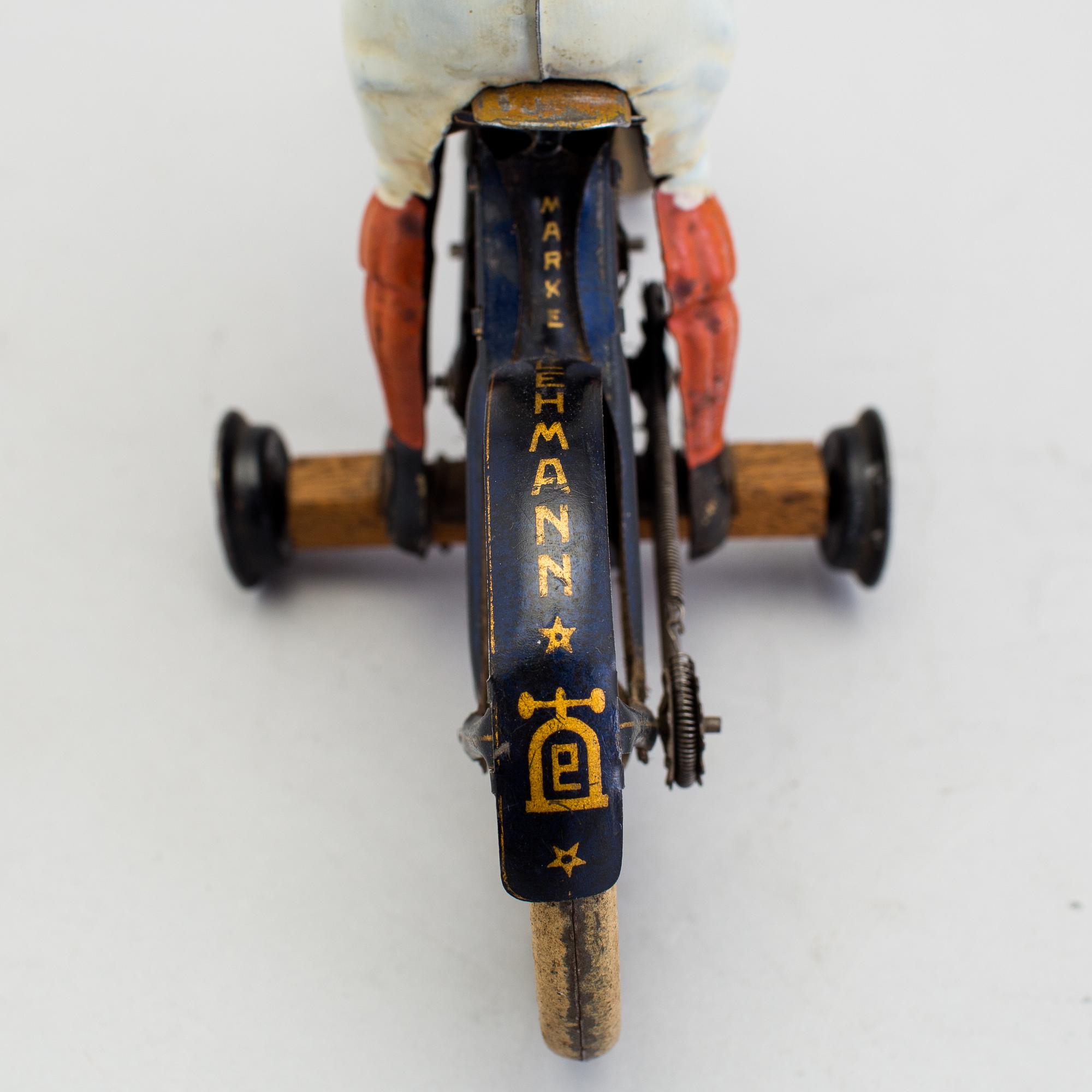 A partially hand painted tinplate Lehmann Halloh motorcycle, Germany. In production 1914-41.
